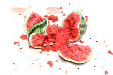Close-up of a broken watermelon isolated on a white background.