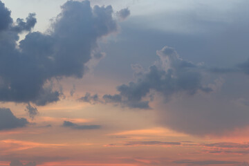 Serene Sunset Sky with Colorful Cloud Patterns and Soft Hues, Capturing the Tranquility of Nature’s Evening Artistry at Dusk and Its Reflective Beauty