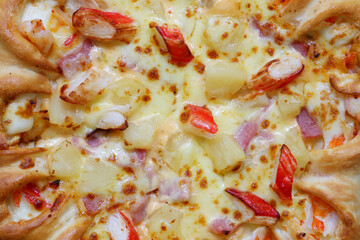 Delicious Close-Up of a Cheesy Pizza Topped with Pepperoni, Pineapple, and Bell Peppers Showcasing...