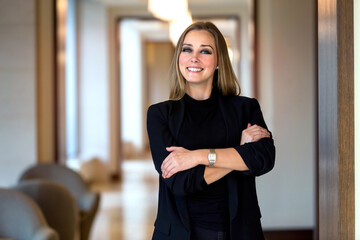 Confident Professional Woman Posing Elegantly in a Modern Office Setting With Soft Lighting and Stylish Decor