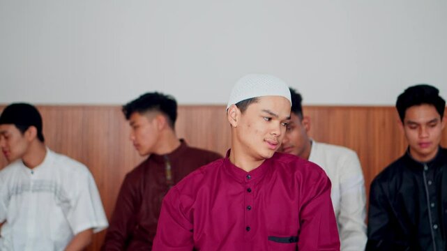 Group Of Young Muslim Friends Done Praying Salah In The Sitting Position On Last Procedure Perform Taslim. Taslim Represents The End Of Prayer.