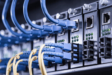 server with fiber optic cables  and network cable in data center