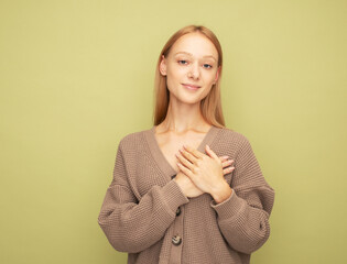 Pretty blond woman wearing brown sweater with cute smile.