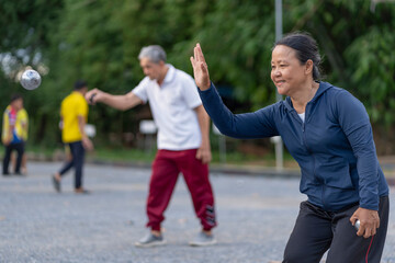 asian senior woman petanque practice on playing field,elderly athlete,sport,workout,health,competition