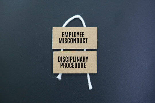 colored paper with the words employee misconduct and disciplinary procedure. unacceptable or inappropriate behavior