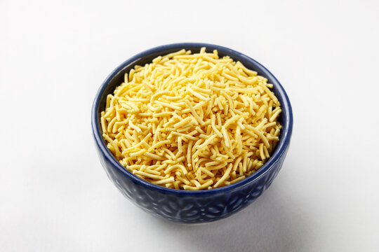 Indian snacks called sev or crispy shev isolated on white background 
