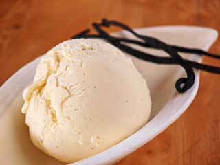 Vanilla ice cream with vanilla bean pods.