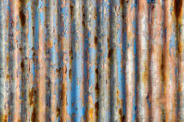 Rusty and Weathered Metal Surface with Blue and Brown Stripes
