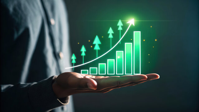 Person holding a glowing green financial growth chart with upward trend