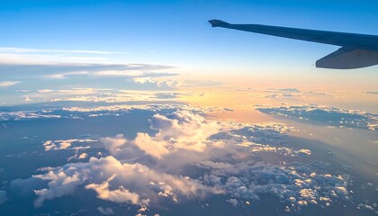Fototapeta premium Airplane view of clouds at sunset.