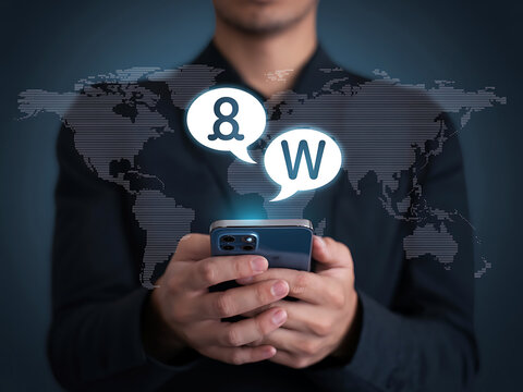 Man holding smartphone with multilingual speech bubbles, concept of global communication - Powered by Adobe