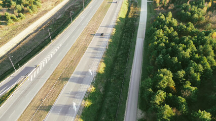 Top-down view of highway and green barriers