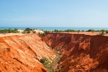 Stunning Red Sand Canyon Under a Clear Blue Sky. A Natural Wonder Landscape View. Mui Ne, Vietnam.