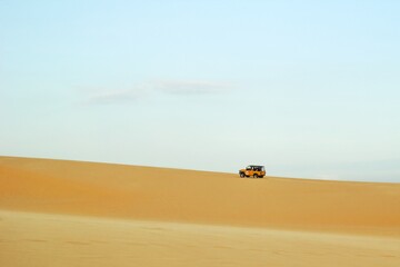 Adventure with Off-Road Vehicle Exploring a Vast Desert Landscape. Mui Ne, Vietnam, White Dunes.