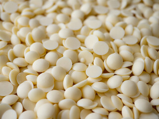 White chocolate chips Pistols buttons. Confection and pastry concept.
