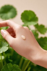 Centella Serum drop on skin with fresh cica leaves around, soothing care for redness and sensitive skin, Selective Focus