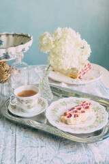 Elegant Tea Time with Fruit Cake and Hydrangeas