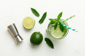 Caipirinha, Mojito cocktail, vodka or soda drink with lime, mint and straw on table background....