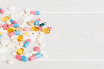 Collection Of Various Medical Tablets And Pills. Assorted pharmaceutical medicine pills, tablets and capsules on table background. Heap of assorted various medicine tablets. Health care