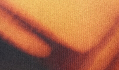 grainy colorful warm orange light leaks on black background with dust texture. abstract damaged...