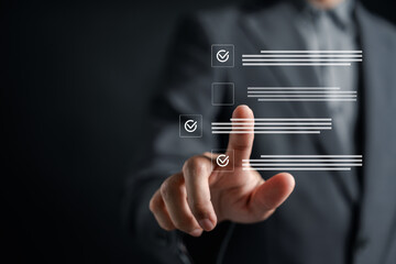 Businessman checking digital document checklist using touchscreen interface. Concept of online form...
