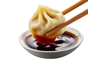 Delicious dumpling held with chopsticks, dripping soy sauce isolated on a transparent or white background