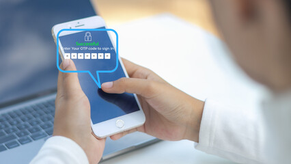 A person enters a one-time password OTP on a smartphone screen to complete the login