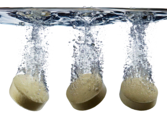 Set of effervescent tablets dissolving in water with bubbles isolated on a transparent or white background
