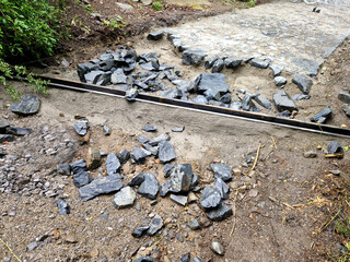 drainage of the threshing floor in the forest beige color transverse metal gutters drain the water...
