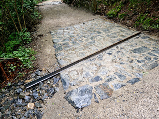 drainage of the threshing floor in the forest beige color transverse metal gutters drain the water...
