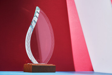 crystal trophy against red background.