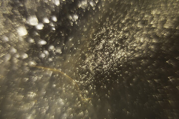Abstract Golden Glitter Burst - Shimmering Bokeh Effect with Golden Sparkles