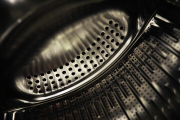 Washing Machine Drum Interior Close-Up Showing Stainless Steel Design
