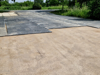 protection of paved roads or sidewalks from damage by working machines or heavy construction, which...