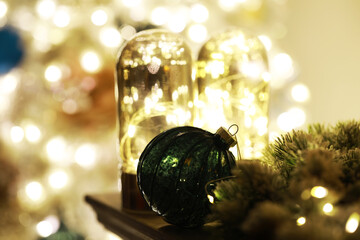 Festive Christmas Decorations with Green Ornament and Soft Glowing Lights