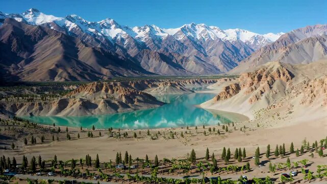 Xinjiang Snow Mountain Lakes Natural Scenery Lakes and green plants under the snow mountains