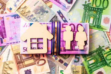 Symbol of home and family against the background of the Euro currency

