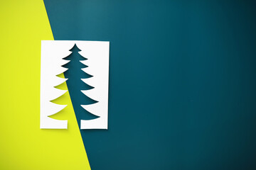 Modern Christmas Tree Cutout on Colorful Geometric Background