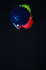 Colorful Glowing Spiky Balls on Dark Background