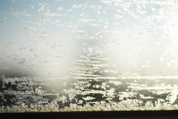 Close-Up of Frost on Window Glass with Morning Sunlight