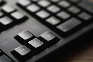 Close-up of Black Computer Keyboard Arrow Keys - Technology and Office Equipment