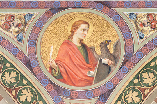BOBBIO, ITALY - MAY 20, 2025:  The fresco of St. John the Evangelist in Cathedral (Santa Maria Assunta) by Luigi Morgari from end of 19. cent. 