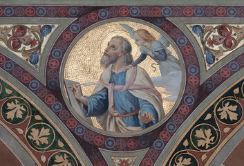 Obraz premium BOBBIO, ITALY - MAY 20, 2025: The fresco of St. Matthew the Evangelist in Cathedral (Santa Maria Assunta) by Luigi Morgari from end of 19. cent. 