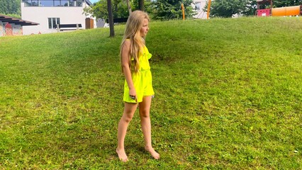 Happy little blonde girl in the park