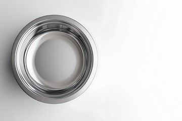 Top-down view of a shiny, empty, round stainless steel bowl on a white background