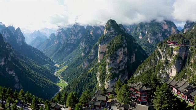 The natural scenery of the ancient buildings in the mountains. Huashan Mountain is shrouded in clouds and mist