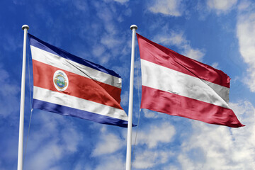 3D illustration. Costa Rica and Austria flags waving in the sky. High detailed waving flag. 3D render. Flags fluttered in the cloudy sky, symbolizing diplomatic relations.