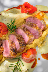 Tenderly cooked lamb salmon on a fine chickpea cream, accompanied by aromatic bell pepper fillets and rounded off with a wonderfully fragrant tarragon sauce