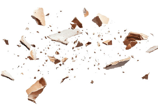 Flying debris created from an explosion disperses dust particles in a dynamic display against a transparent background capturing energy and movement