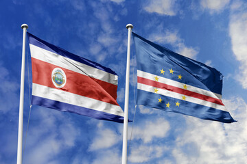 3D illustration. Costa Rica and Cabo Verde flags waving in the sky. High detailed waving flag. 3D render. Flags fluttered in the cloudy sky, symbolizing diplomatic relations.